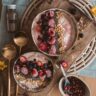 Two Mediterranean diet bowls with oats, berries, and nuts